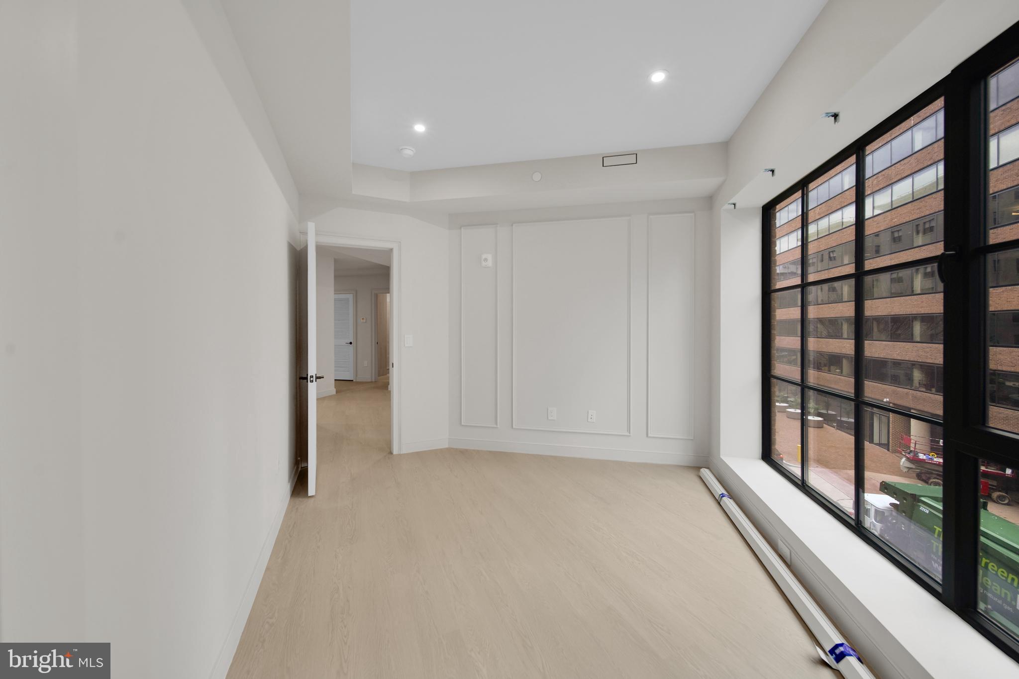 2121 Ward Place Northwest, Unit 401 Washington, DC 20037 - Photo 14 of 21 wooden floor in an empty room with a window