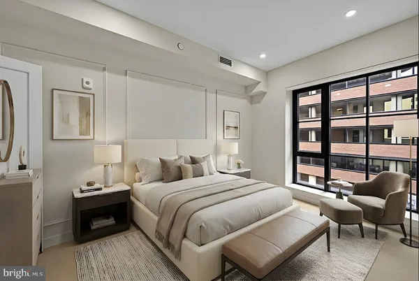a bedroom with a bed and a couch