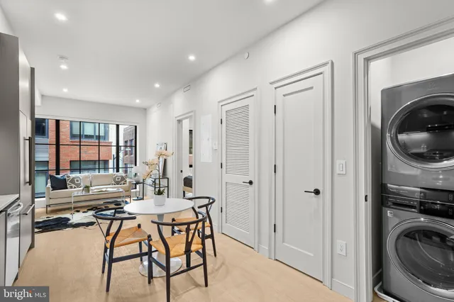 a view of a dining room with furniture and a livingroom