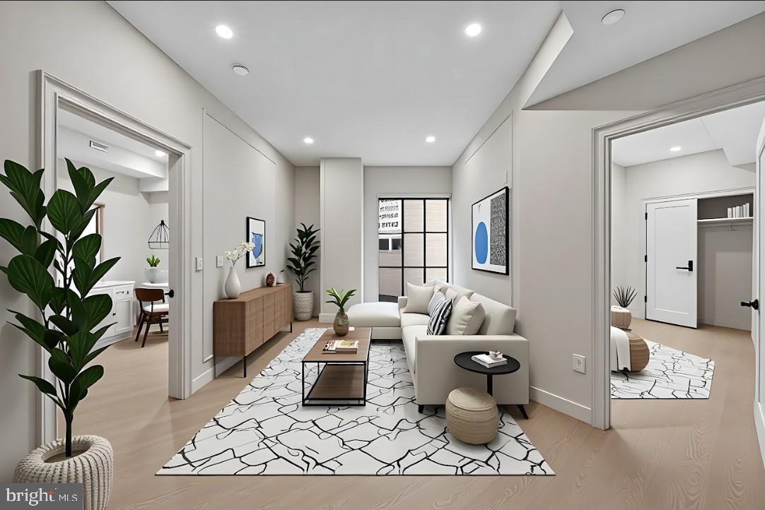 2121 Ward Place Northwest, Unit 401 Washington, DC 20037 - Photo 3 of 21 a living room with furniture and a potted plant