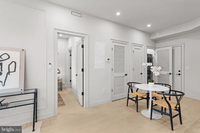 a view of a room with entryway dining table and chairs