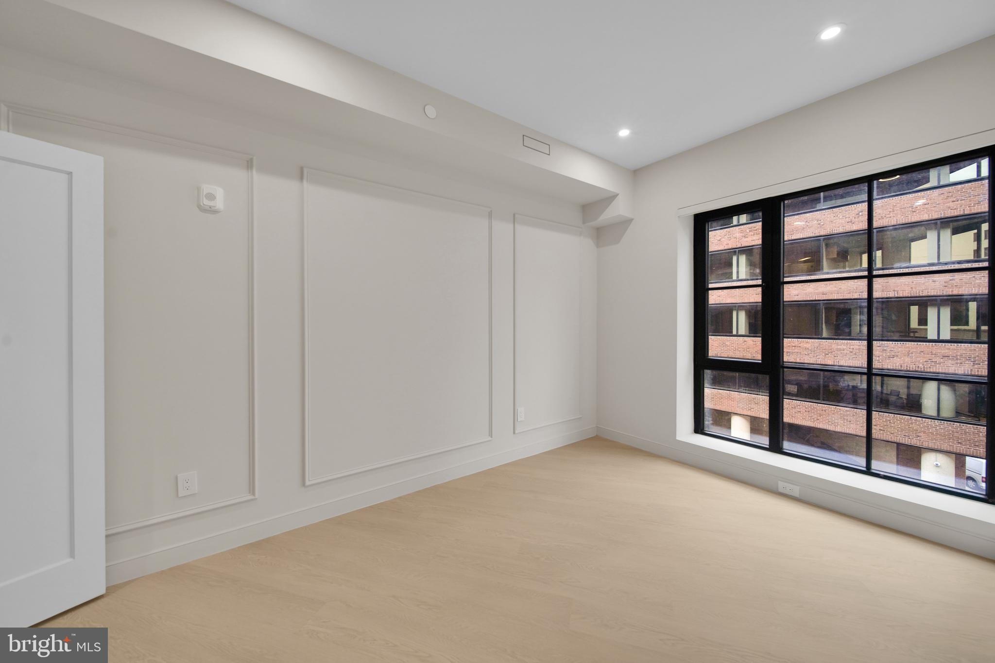2121 Ward Place Northwest, Unit 401 Washington, DC 20037 - Photo 8 of 21 a view of an empty room with glass door