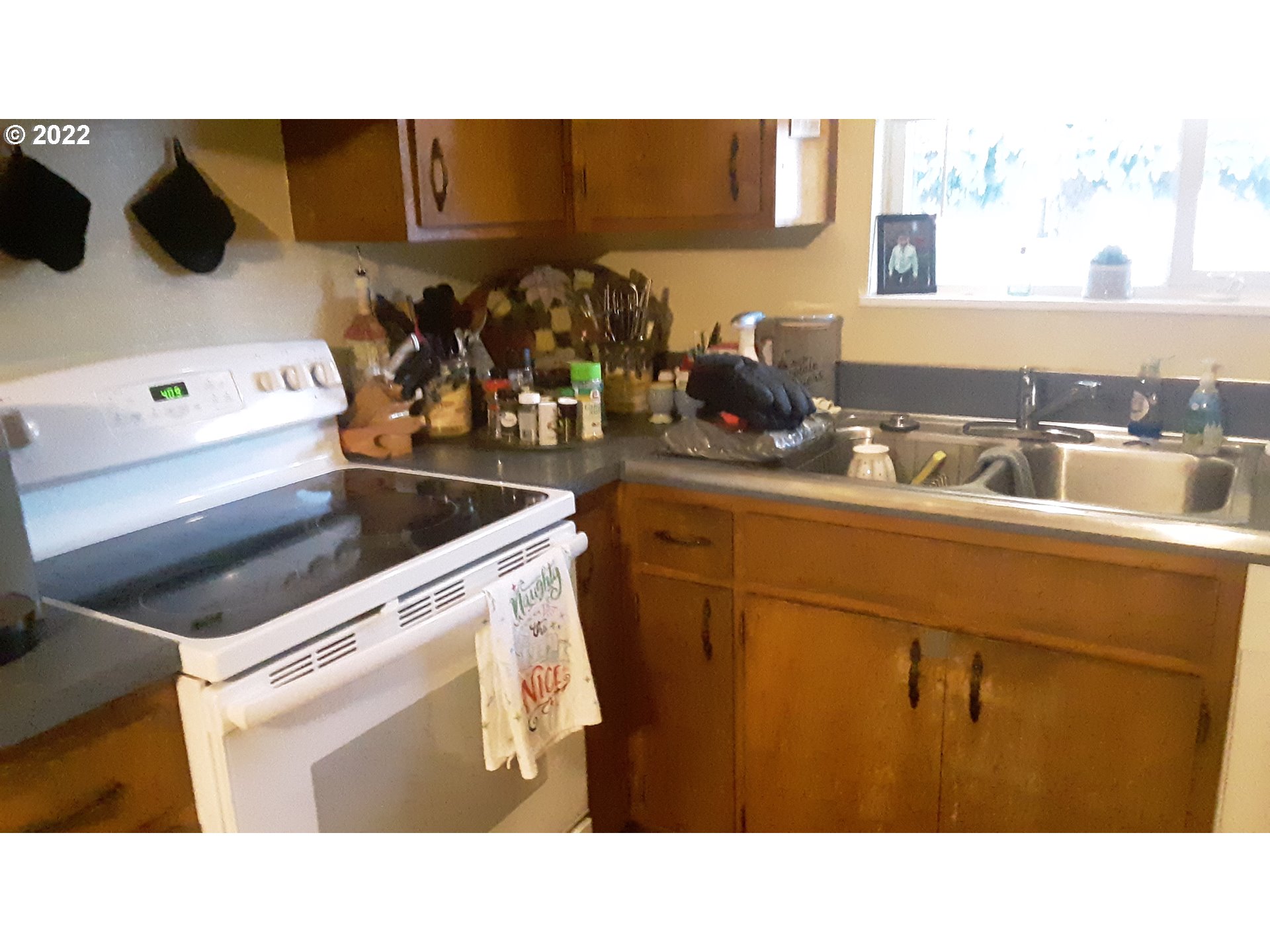 210 North 38th Place Springfield, OR 97478 - Photo 8 of 20 a kitchen with a sink and cabinets