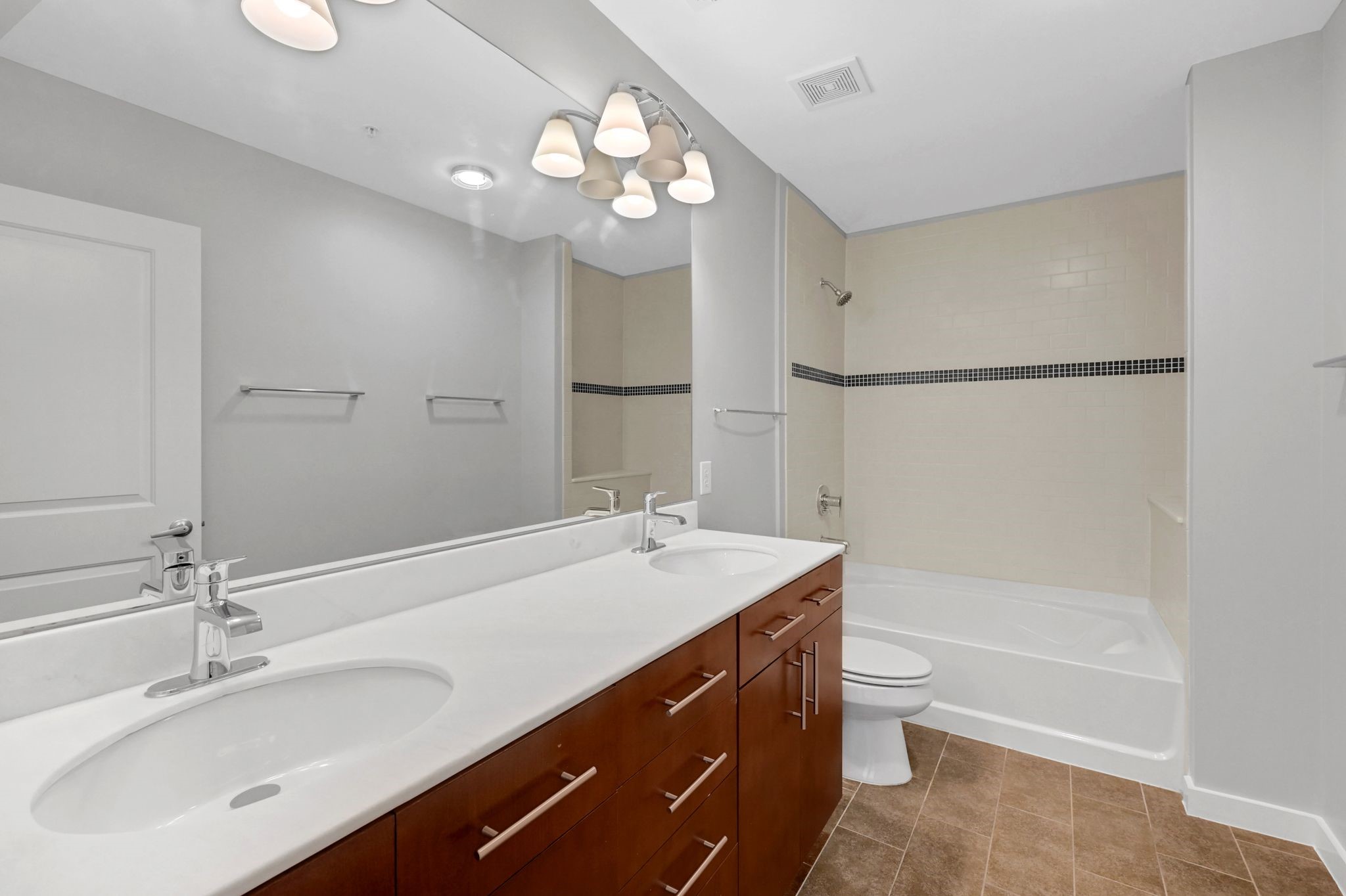 5925 Almeda Road, Unit 11501 Houston, TX 77004 - Photo 13 of 30 a bathroom with a sink double vanity granite tub and a mirror