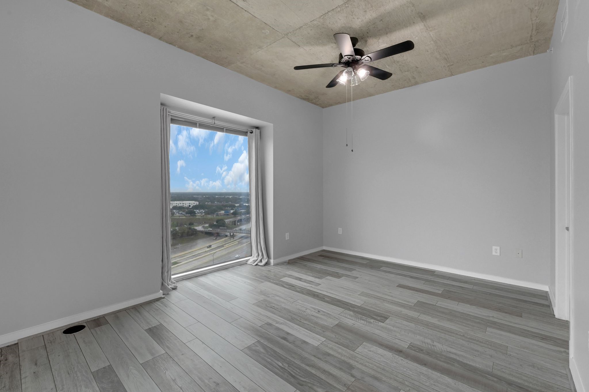 5925 Almeda Road, Unit 11501 Houston, TX 77004 - Photo 8 of 30 wooden floor in an empty room with a window