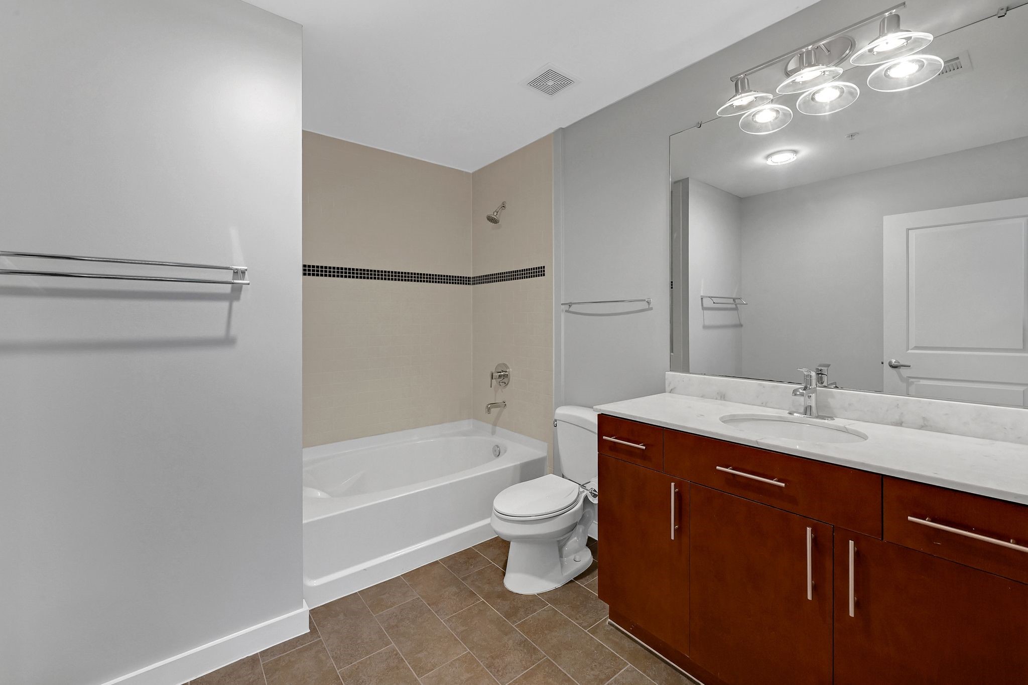 5925 Almeda Road, Unit 11501 Houston, TX 77004 - Photo 10 of 30 a bathroom with a sink a toilet and shower