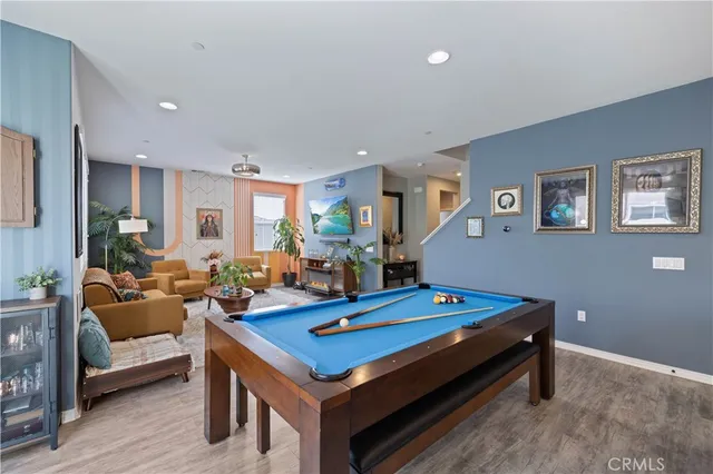 a large kitchen with a table and chairs