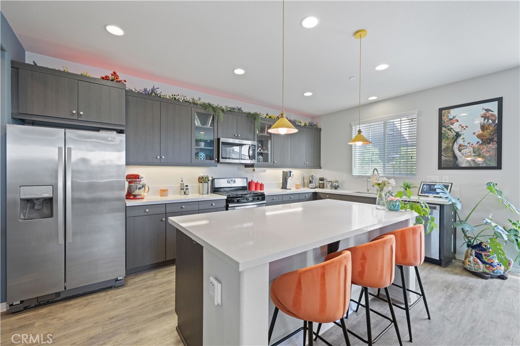 22088 Windham Way Saugus, CA 91350 - Photo 13 of 62 a large kitchen with a table and chairs
