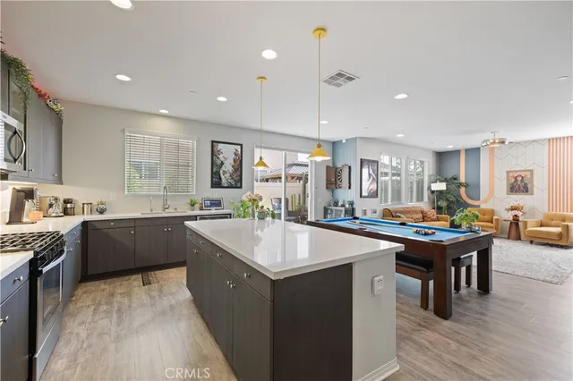 a kitchen with a table and chairs in it