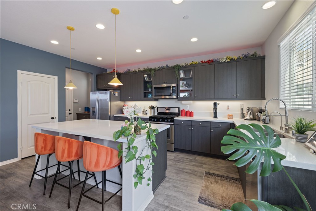 22088 Windham Way Saugus, CA 91350 - Photo 16 of 62 a kitchen with a table and chairs in it