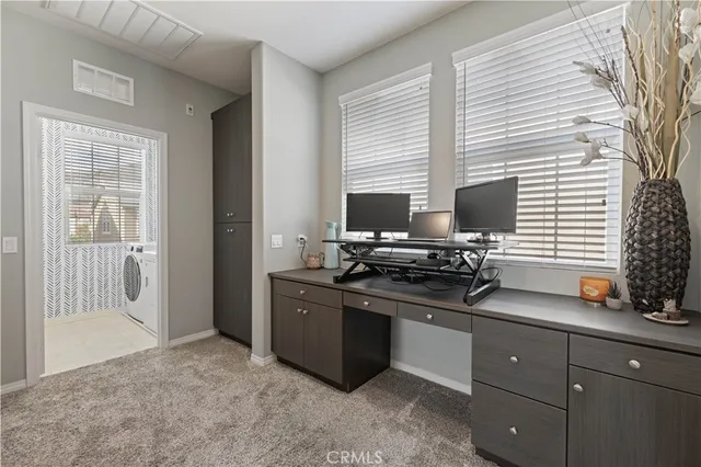 a bathroom with a sink vanity mirror and toilet