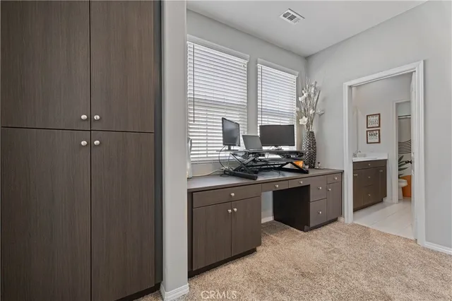 a bedroom with a bed and the view of bathroom