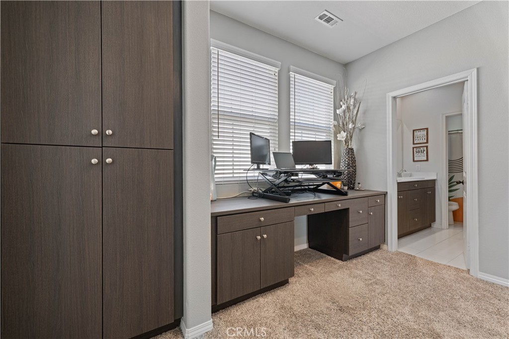 22088 Windham Way Saugus, CA 91350 - Photo 23 of 62 a kitchen with stainless steel appliances granite countertop a stove a sink and a refrigerator