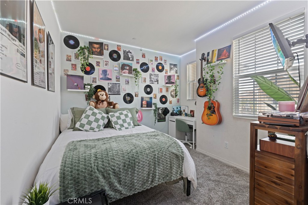 22088 Windham Way Saugus, CA 91350 - Photo 25 of 62 a bedroom with a bed and wooden floor