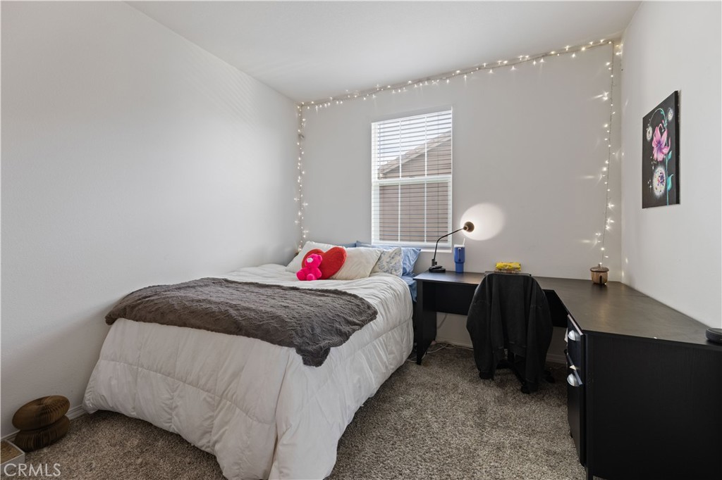 22088 Windham Way Saugus, CA 91350 - Photo 27 of 62 a bedroom with a bed and a window