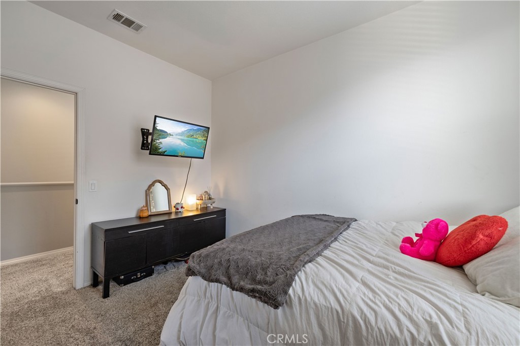 22088 Windham Way Saugus, CA 91350 - Photo 28 of 62 a bedroom with a bed and a flat screen tv