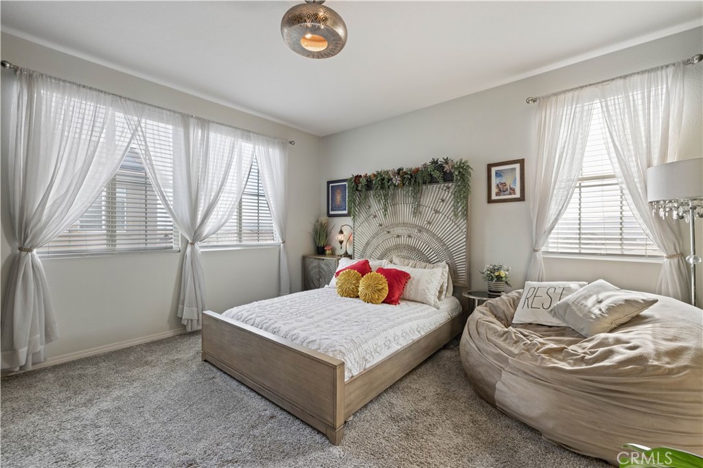 22088 Windham Way Saugus, CA 91350 - Photo 30 of 62 a bedroom with a bed and window