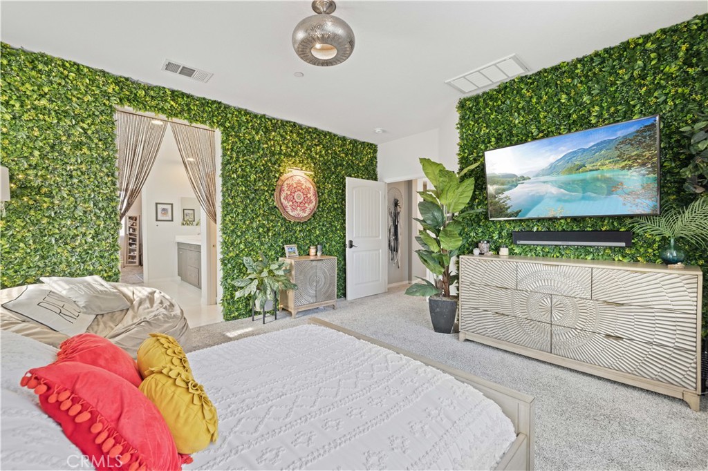 22088 Windham Way Saugus, CA 91350 - Photo 32 of 62 a bedroom with a bed and a flat screen tv