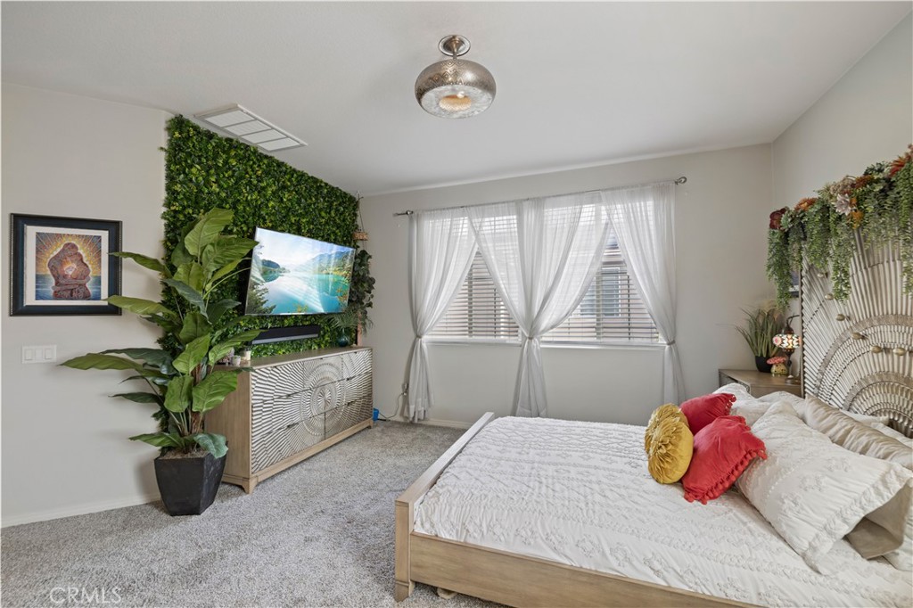 22088 Windham Way Saugus, CA 91350 - Photo 33 of 62 a bedroom with a bed and a flat screen tv