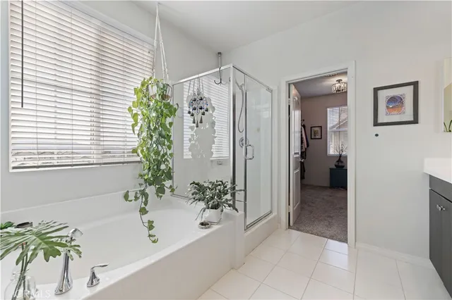 a bath room with a bathtub and shower