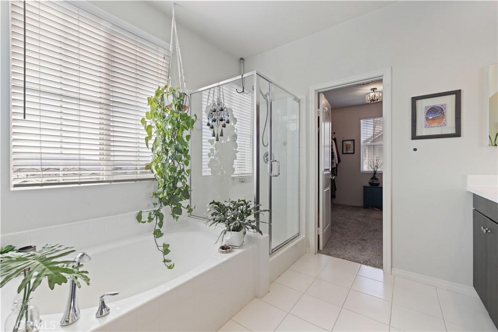 22088 Windham Way Saugus, CA 91350 - Photo 37 of 62 a bathroom with a bathtub and a shower