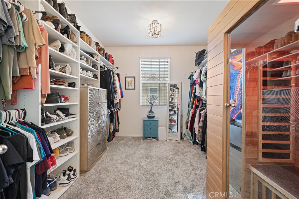 22088 Windham Way Saugus, CA 91350 - Photo 38 of 62 a view of walk in closet with clothes and shoes
