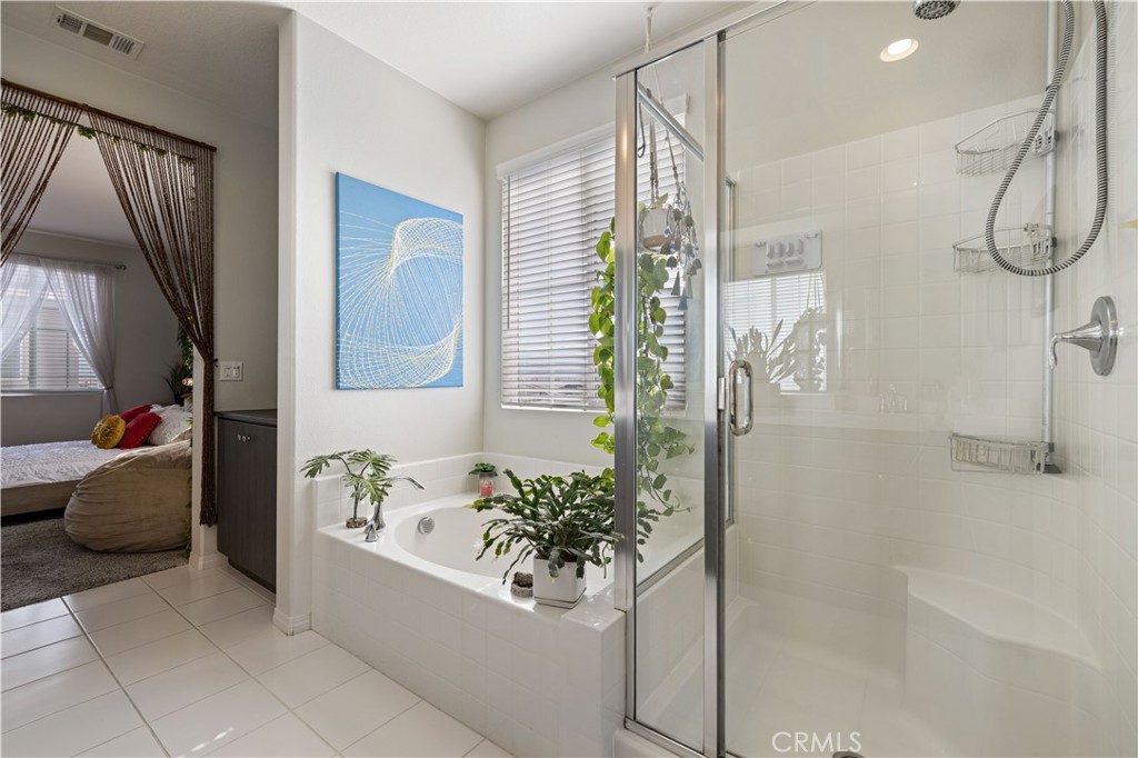 22088 Windham Way Saugus, CA 91350 - Photo 40 of 62 a bath room with a bathtub and shower
