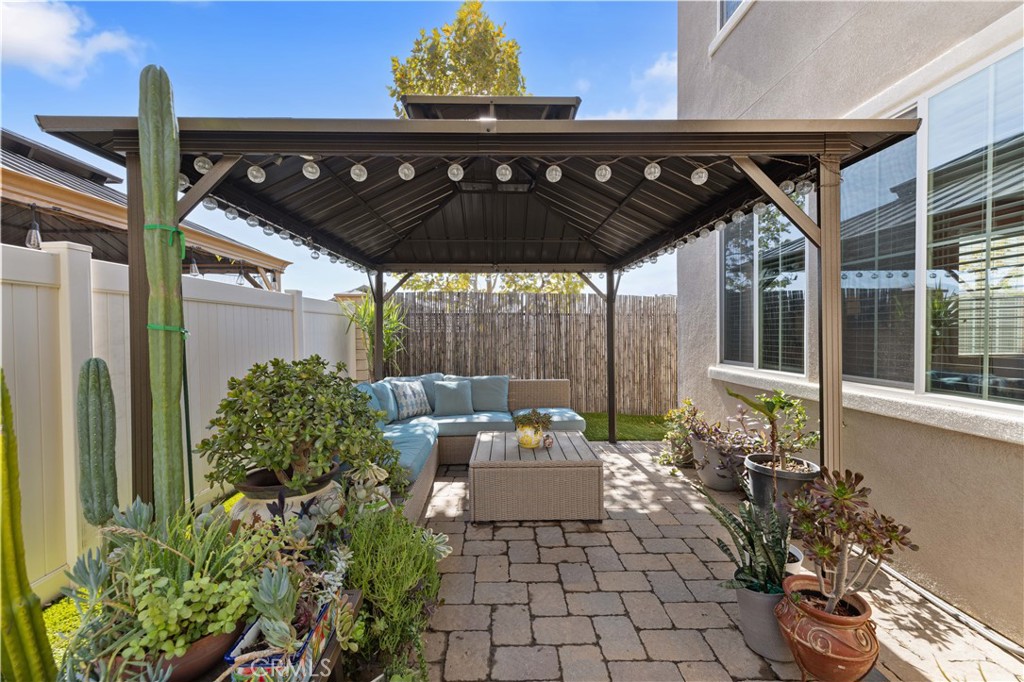 22088 Windham Way Saugus, CA 91350 - Photo 44 of 62 a view of a patio with table and chairs potted plants