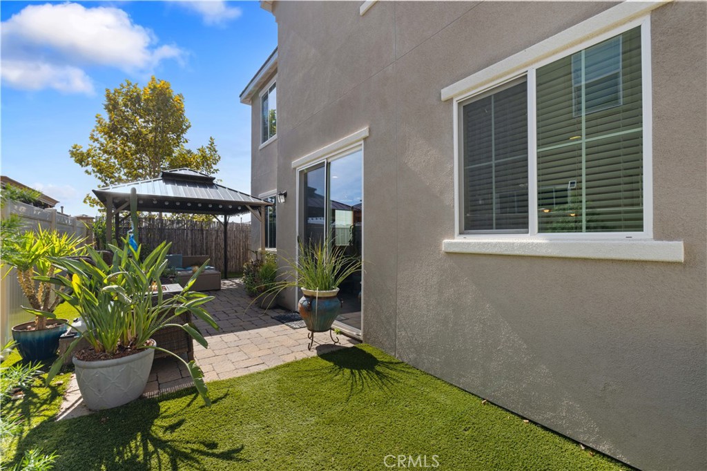 22088 Windham Way Saugus, CA 91350 - Photo 49 of 62 a backyard of a house with yard and outdoor seating