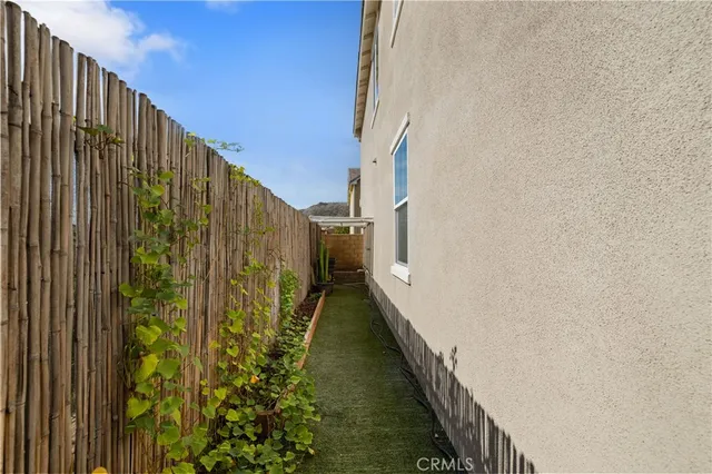a view of a patio with swimming pool and chairs