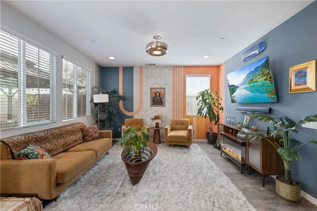 a living room with furniture and a large window