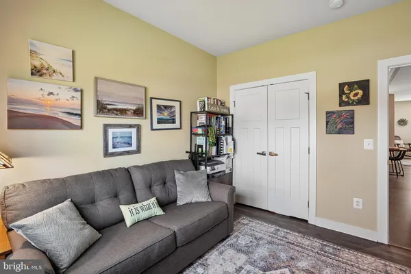 a bedroom with a bed and a couch