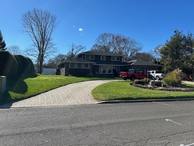 24 Colonial Drive Waterford, CT 06385 - Photo 1 of 25 a view of a house with a yard and sitting area