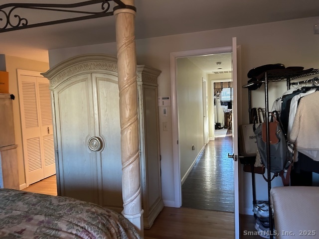 24 Colonial Drive Waterford, CT 06385 - Photo 14 of 25 a view of hallway with wooden floor