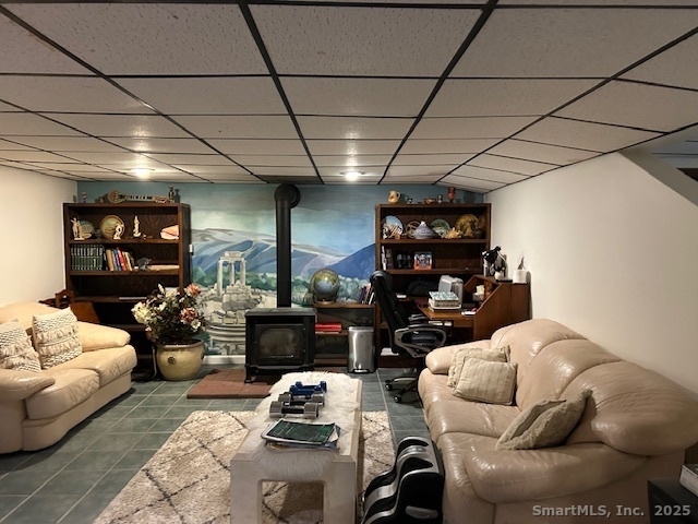 24 Colonial Drive Waterford, CT 06385 - Photo 20 of 25 a living room with furniture a couch and a bookshelf