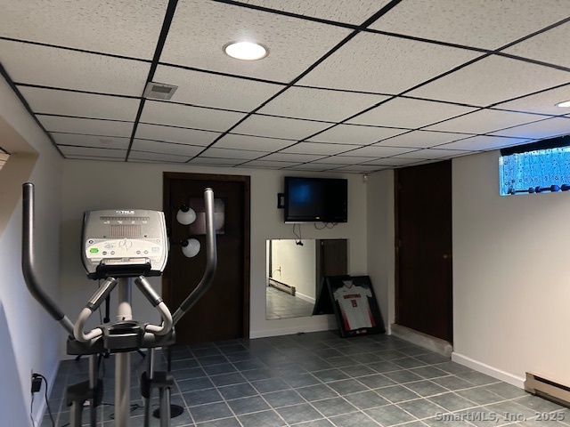 24 Colonial Drive Waterford, CT 06385 - Photo 21 of 25 a room with furniture and a flat screen tv