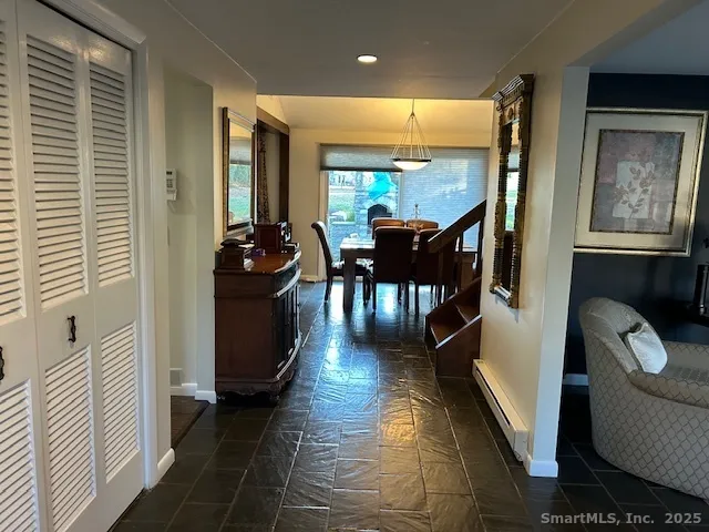 a dining room with furniture and wooden floor
