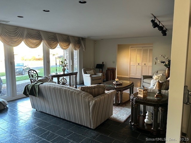 24 Colonial Drive Waterford, CT 06385 - Photo 5 of 25 a living room with furniture and a floor to ceiling window