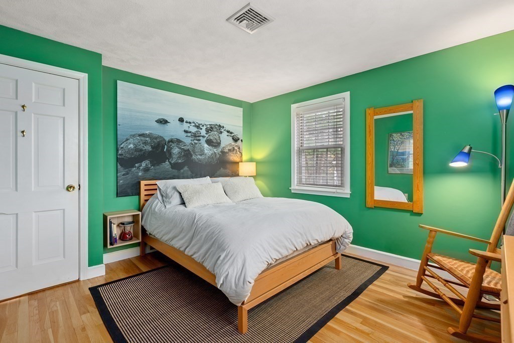 42 Bradyll Road Weston, MA 02493 - Photo 19 of 31 a bed sitting in a bedroom next to a window