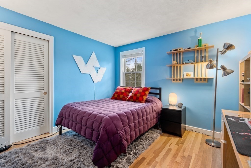 42 Bradyll Road Weston, MA 02493 - Photo 20 of 31 a bedroom with a bed and a window