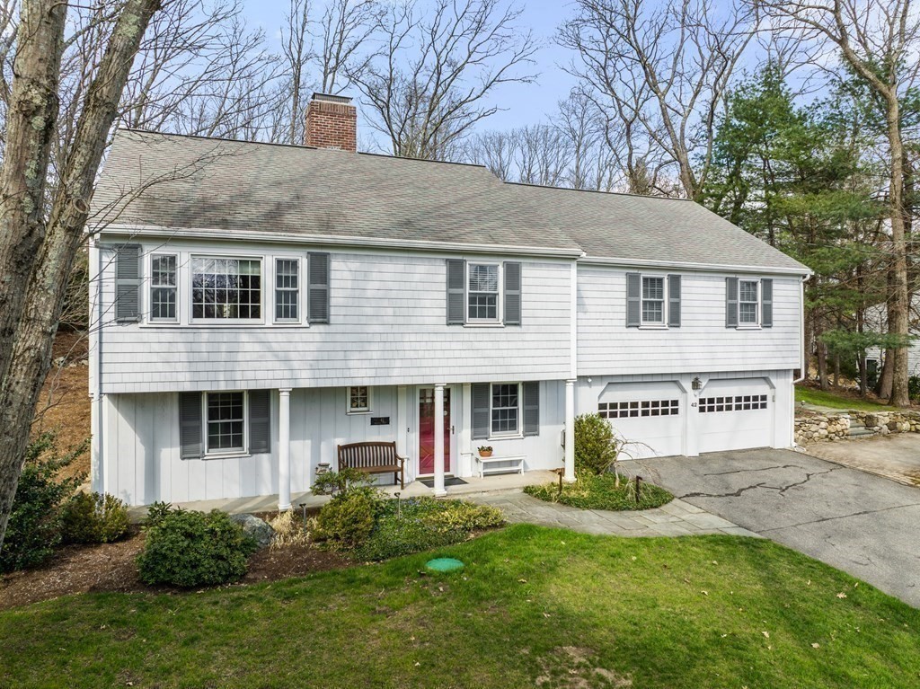 42 Bradyll Road Weston, MA 02493 - Photo 31 of 31 a front view of a house with a yard and garage