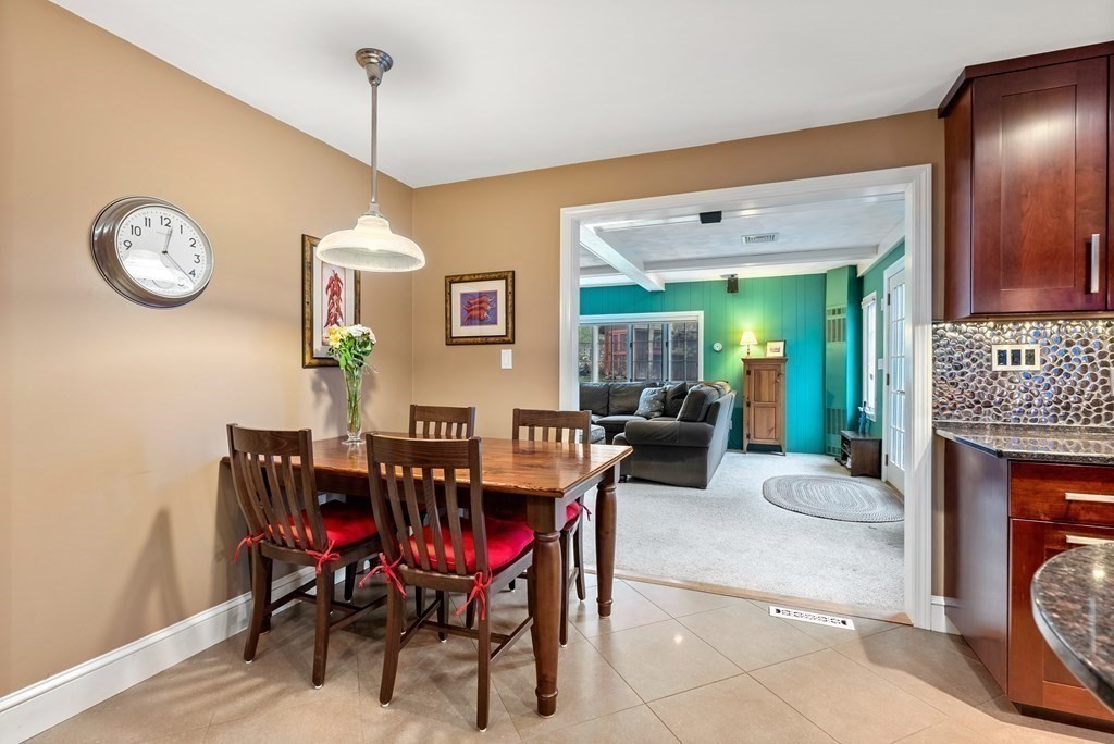 42 Bradyll Road Weston, MA 02493 - Photo 10 of 31 a view of a dining room with furniture and chandelier