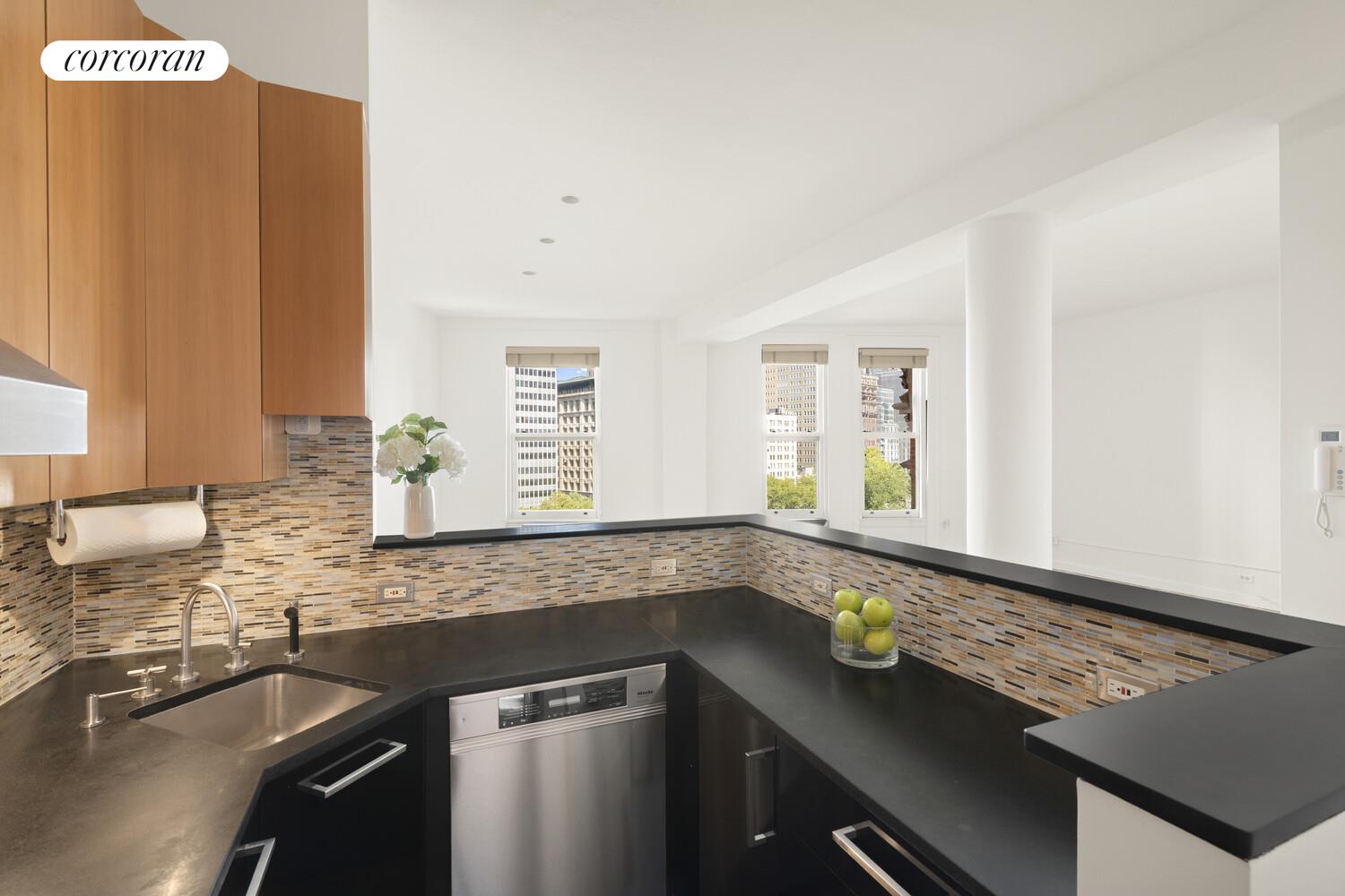 145 Nassau Street, Unit 8A Manhattan, NY 10038 - Photo 8 of 26 a kitchen with a sink and a window