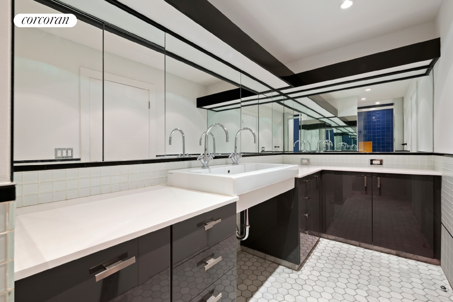 145 Nassau Street, Unit 8A Manhattan, NY 10038 - Photo 11 of 26 a bathroom with a sink and a mirror