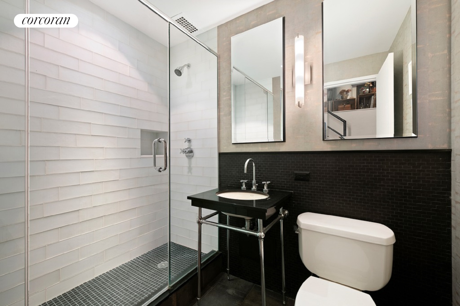 145 Nassau Street, Unit 8A Manhattan, NY 10038 - Photo 12 of 26 a bathroom with a toilet a sink and a mirror