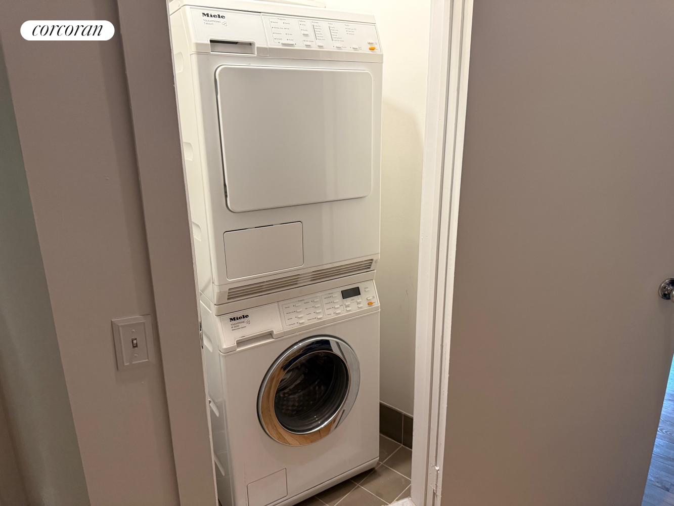 145 Nassau Street, Unit 8A Manhattan, NY 10038 - Photo 13 of 26 a utility room with dryer and washer