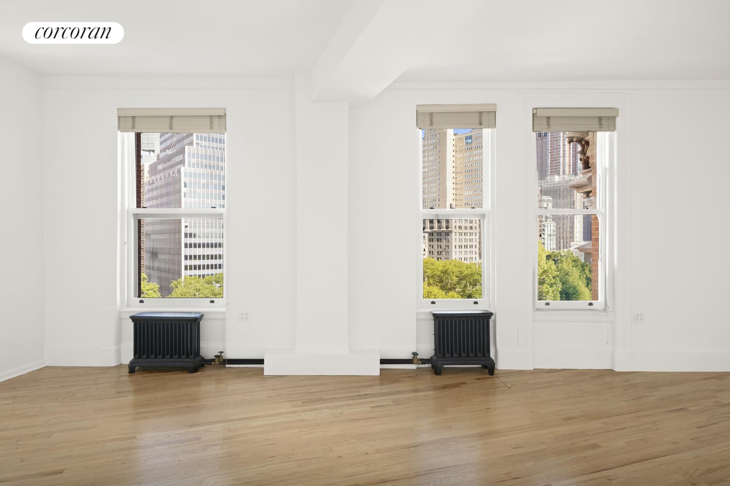 145 Nassau Street, Unit 8A Manhattan, NY 10038 - Photo 14 of 26 a view of an empty room with a window