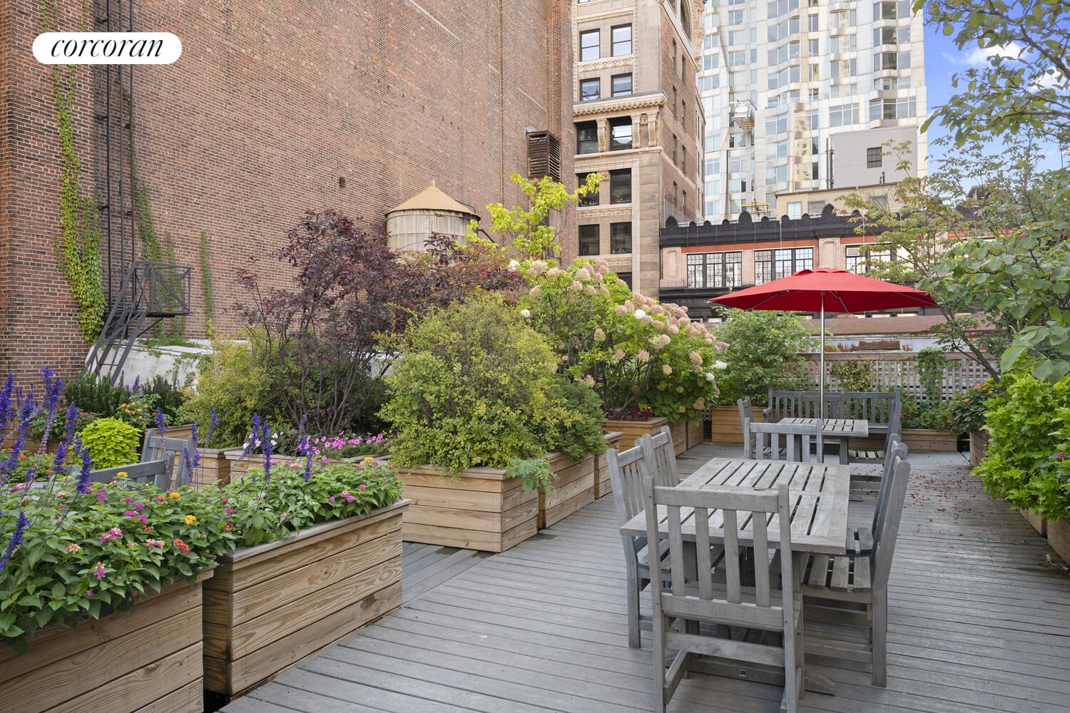145 Nassau Street, Unit 8A Manhattan, NY 10038 - Photo 15 of 26 a view of a table and chairs in patio with potted plants
