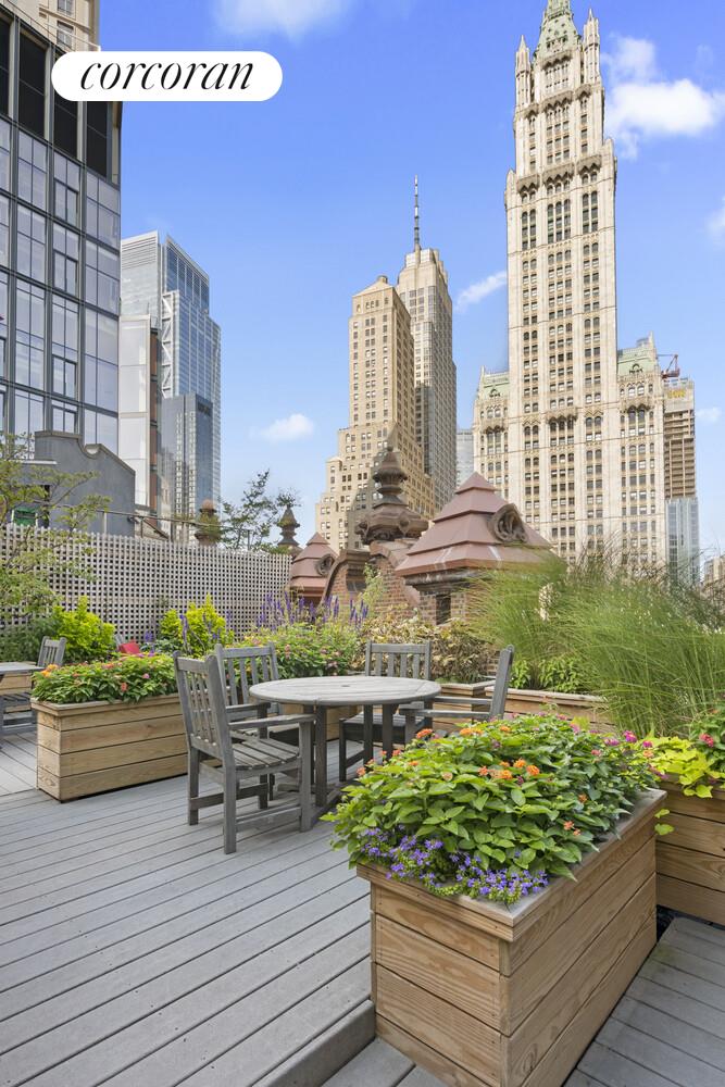 145 Nassau Street, Unit 8A Manhattan, NY 10038 - Photo 16 of 26 a view of a chairs and table in the terrace