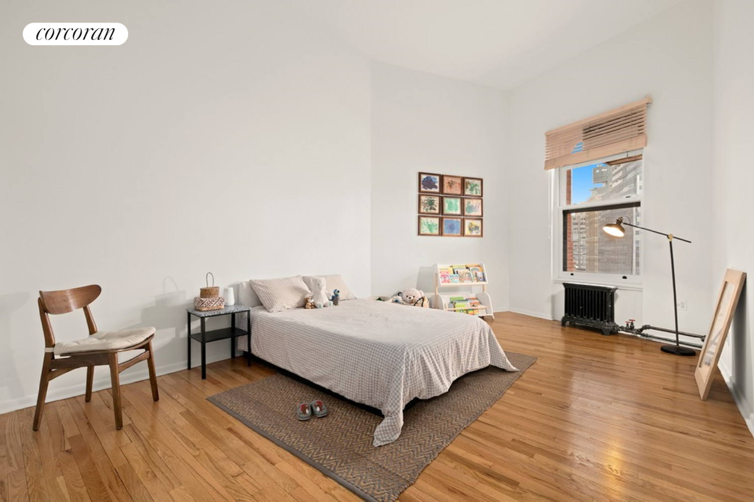 145 Nassau Street, Unit 8A Manhattan, NY 10038 - Photo 6 of 26 a bedroom with a bed and a table